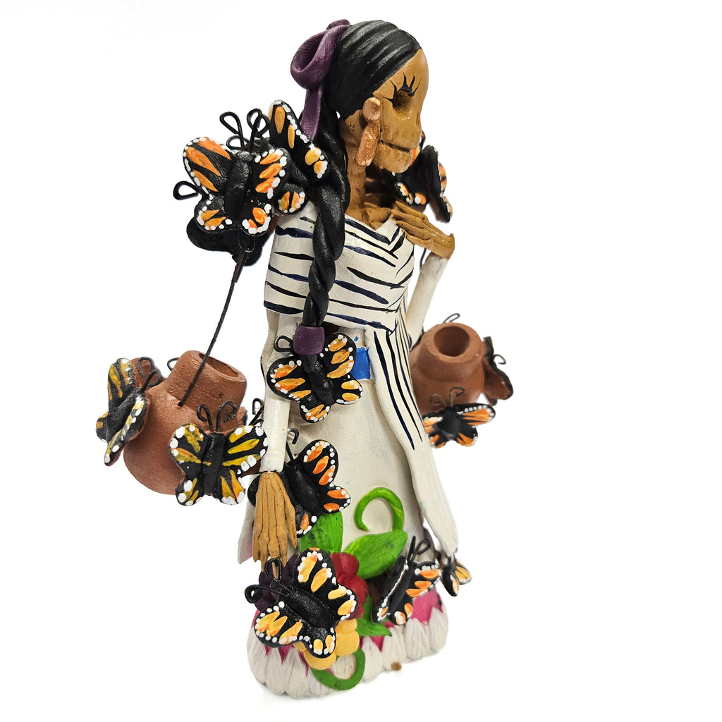 Catrina with water jugs and butterflies