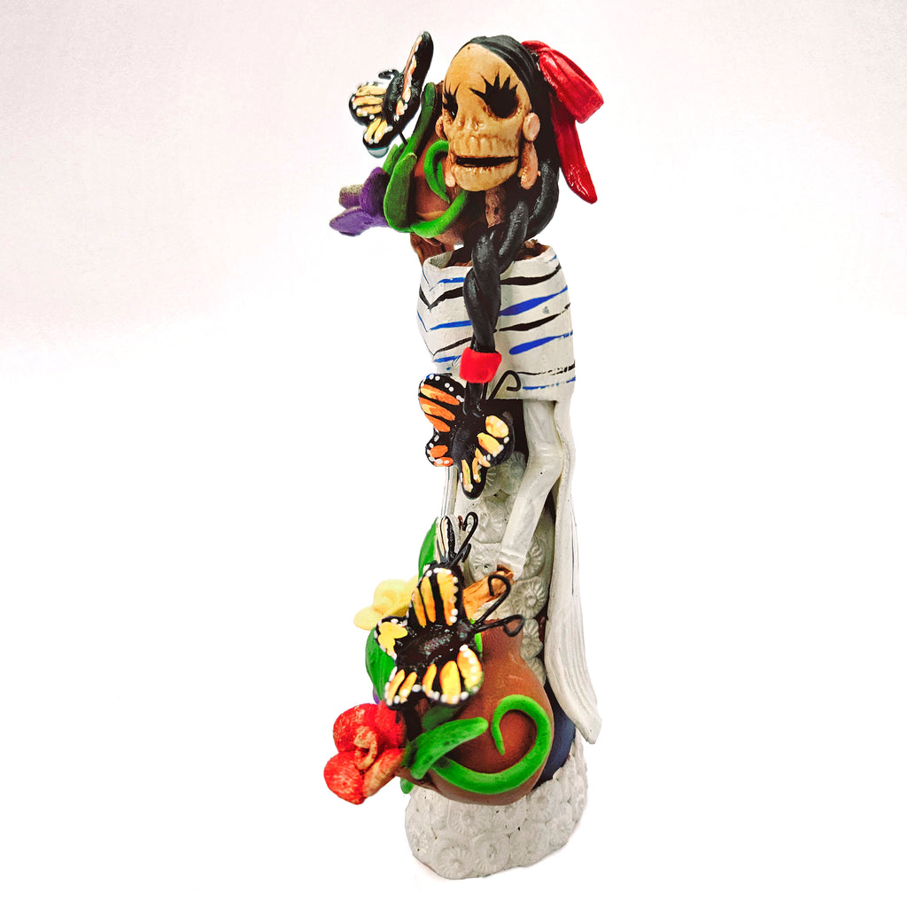 Catrina with white dress, vase and butterflies