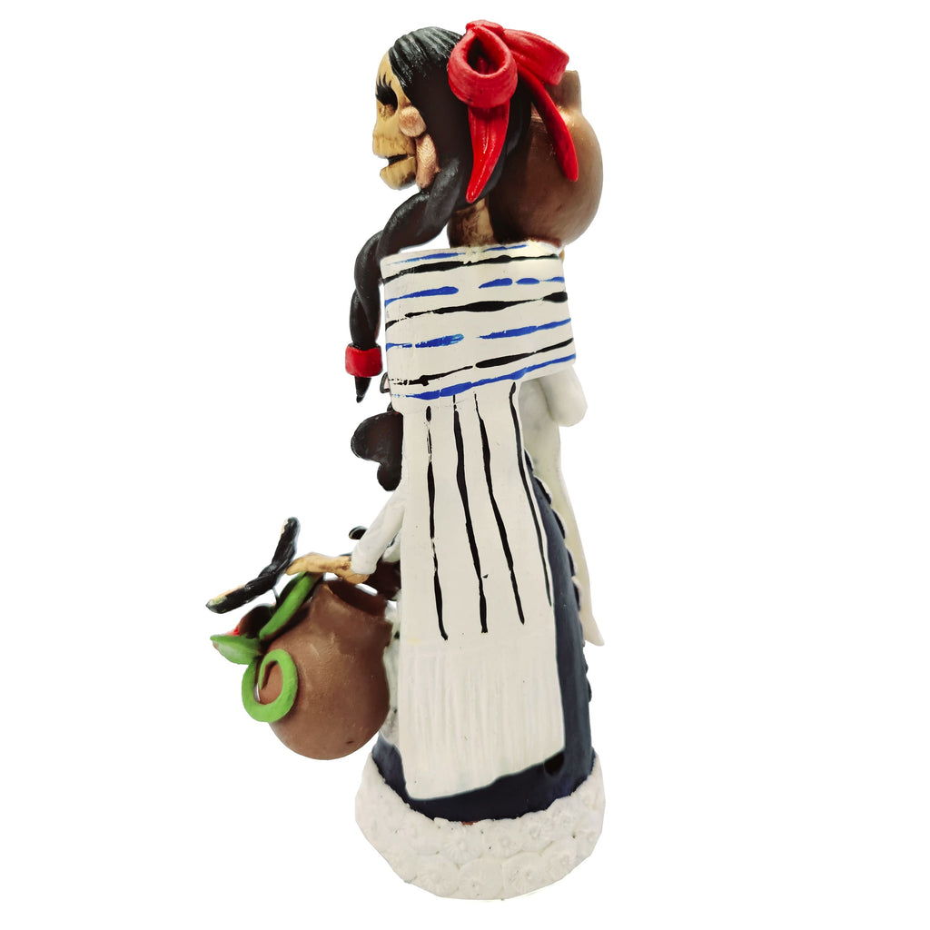 Catrina with white dress, vase and butterflies